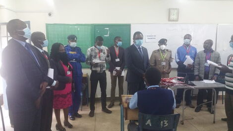 University teaching and research PS Amb. Simon Nabukwesi is overseeing the distribution of the first article of the fourth day of KCSE at the Nairobi school on March 31, 2021.