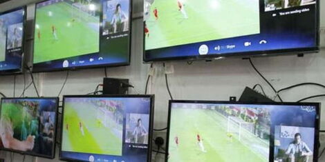 An image of television sets displayed in an electronics shop