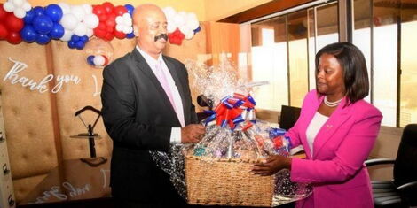General Lieutenant General Mohamed Badi receiving a gift basket from former NMS head of communications Rose Gakuo on Friday, September 30, 2022