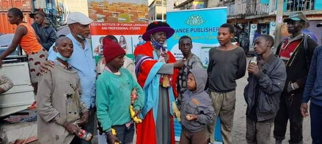 Dr Hassan Omari celebrating his graduation with street children.