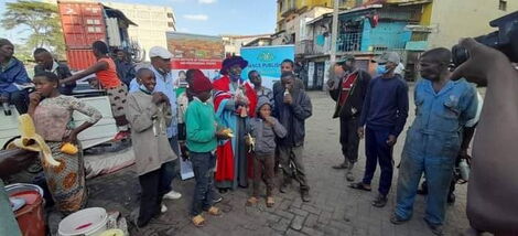 Dr Hassan Omari celebrating his graduation with street children.