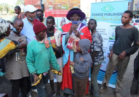 Dr Hassan Omari celebrating his graduation with street children in December 2020.