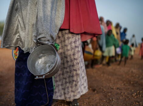 Women and children lining up for relief food in 2019.