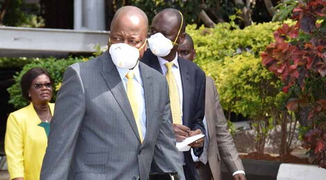 Health CS Mutahi Kagwe (front) with Ministry of Health director-general Dr. Patrick Amoth at a press briefing on April 2, 2020.