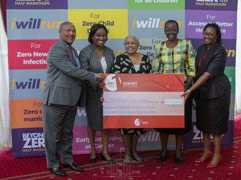 First lady Margaret Kenyatta receives a donation from the Kenya Broadcasting Corporation (KBC) in support of the Beyond Zero Marathon in Nairobi on Tuesday, February 18