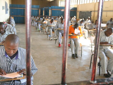Inmates at the Naivasha GK Prison take a Mathematics test during the 2013 Kenya Certificate of Primary Education exam.