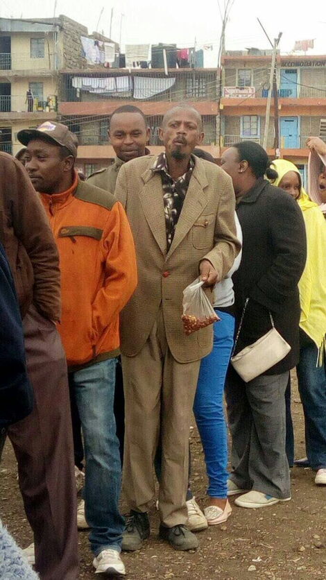 Martin Kamotho alias Githeri man queuing to vote in 2017.