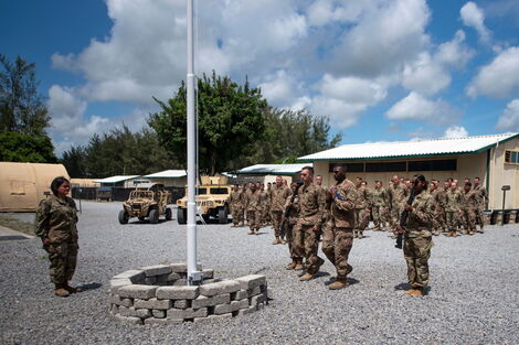 U.S. Air Force, airmen from the 475th Expeditionary Air Base Squadron conduct a flag-raising ceremony at Camp Simba, Manda Bay, Kenya on August 26, 2019.