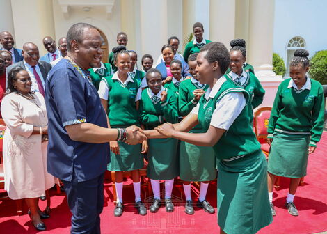 President Uhuru Kenyatta interacts with students of Nyiro Girls’ Secondary School, Samburu County at State House, Nairobi after donating a bus to the school on Friday, November 1, 2019.