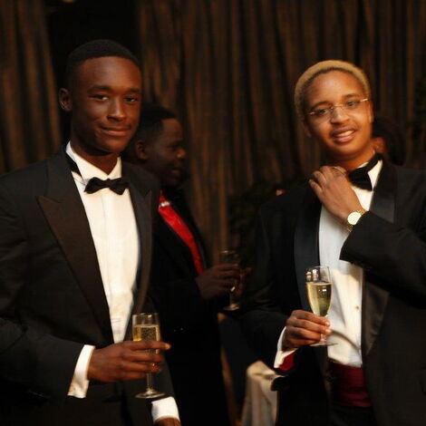 A photo of Kigen Moi together with his friend at an event.