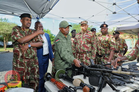 Interior CS Kithure Kindiki with senior officers at the Border Police Unit airstrip in Kanyonyo, Kitui County on November 25, 2022.