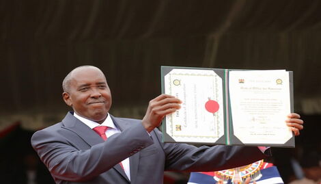 Governor Joseph Ole Lenku showing his certificate after being sworn in at Ilidamat Stadium on August 25, 2022