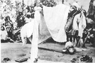 Yogi Pullavar levitating at an event in 1936.