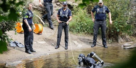 Divers in the UK extracting Logam Mwangi's body from River Ogmore in the UK.