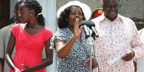 Former President Mwai Kibaki, the late Lucy Kibaki and one of their grand-daughters outside in Mombasa after attending Christmas service on December 25, 2008.