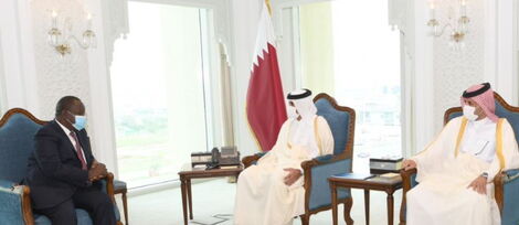 Interior CS Fred Matiang'i (left) with Qatar Prime Minister Sheikh Khalid Bin Khalifa Bin Abdulaziz Al-Thani, in Doha on March 16, 2021.