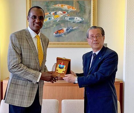 Rtd Maj Gen. Andrew Ikenye (left) exchanging gifts with Amb. Yasuyoshi Komizo, the chairperson of the Hiroshima Peace Culture Foundation in May 2019.