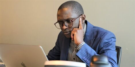 Kenyans.co.ke digital journalist John Mbati at work 