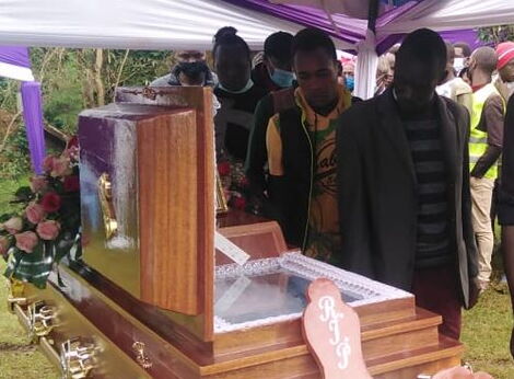 Relatives and friends view the body of the late Caroline Chemutai Kangogo at Nyawa, Elgeyo Marakwet