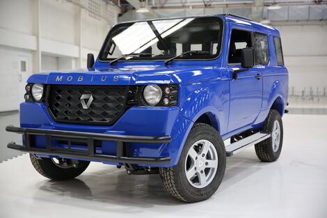 A photo of Mobius motors SUV, third model in a showroom.