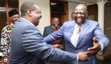 Musalia Mudavadi (left) shares a light moment with his ANC Chairman Kelvin Lunani (centre) and wife Sarah Otieno during Lunani's wedding ceremony in Mombasa on December 15, 2018
