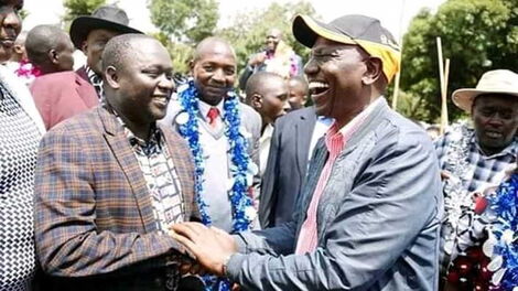 Dennis Kapchok (left) with DP William Ruto (right) 