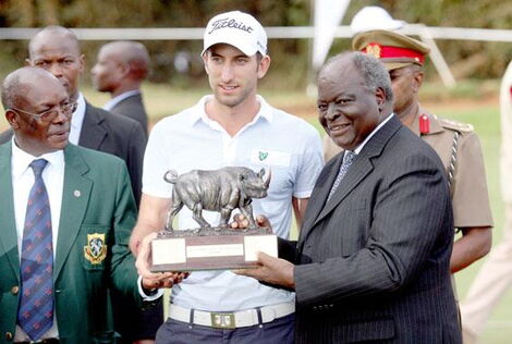 Mwai Kibaki receives the Hall of Fame Honours during the 50th year of the Kenya Open golf tournament..