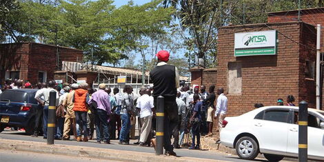 A crowd outside the National Transport and Safety Authority when detectives raided the premises on January 30, 2019