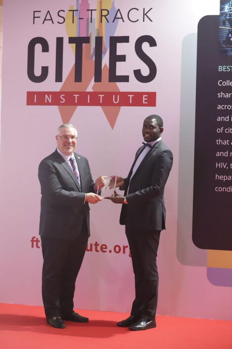 NMS Director of Health Ouma Oluga receiving the award from Dr. José Zuniga on October 21 in Lisbon, Portugal.