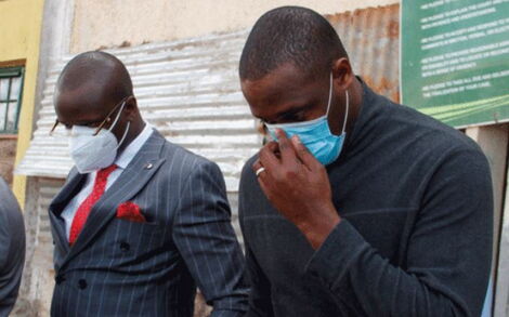 Chris Philip Obure (left) and co-accused Robert John Ouko Bodo in court on August 24.