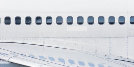 An image showcasing the round-shaped windows of an aeroplane.