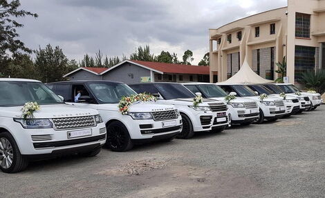 A convoy of white Range Rovers used for a past wedding