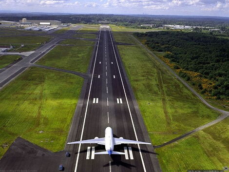 A stock image of a plane on an airport runway.