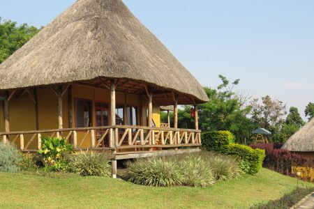 Image of a grass thatched outdoor hotel cabin