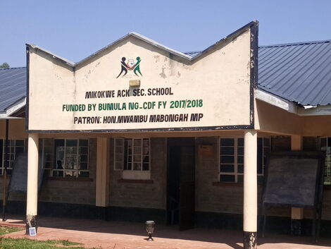 A signpost showing Mikokwe ACK Secondary School 