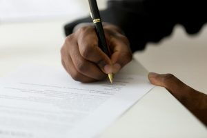 Person signing an insurance policy