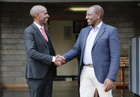 Nominated Member of Parliament (MP) Wilson Sossion shakes hands with Deputy President William Ruto on Monday, October 11.