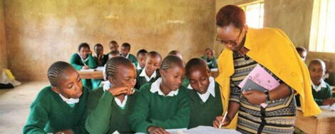 File image of a teacher and students in class 