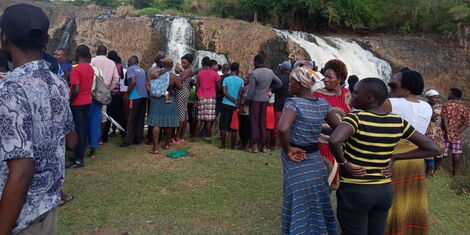 Residents gather at Ndia Iri in River Kathita, Tharaka Nithi County where local divers were searching for the bodies of four Tharaka University College students who drowned on November 6, 2021