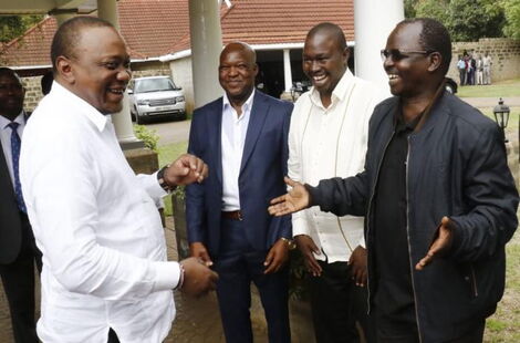 Governor Lonyangapuo (in black Jacket) shares a light moment with President Uhuru Kenyatta in 2019.