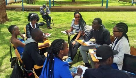 A group of college students holding a discussion.