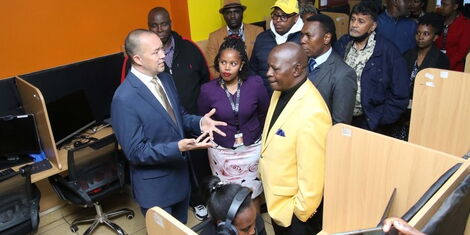 ONQ Kenya CEO Sean Hammerle together Nyeri Governor Mutahi at their call center on August 4, 2022.