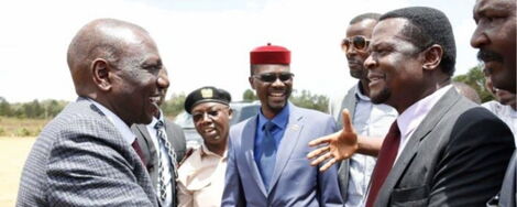 Deputy President William Ruto greets Sirisia MP John Waluike at an event in Bungoma County in 2018