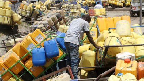 Water Vendors wait for their turn to fetch water at Kitengela on July 21, 2018.