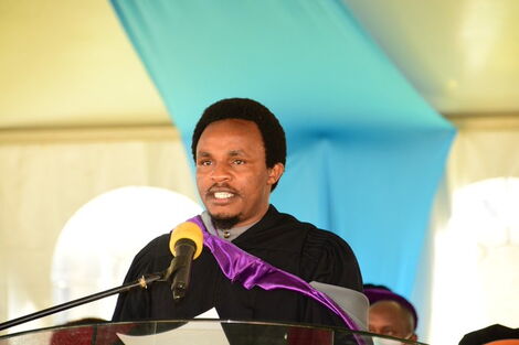 Education CAS Zack Kinuthia speaking during UoN's 64th graduation ceremony 