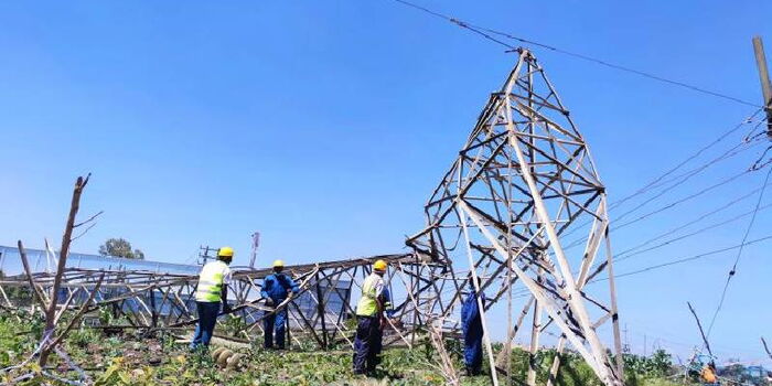 Engineers at a collapsed Kiambere-Embakasi Highway voltage transmission powerline