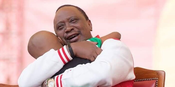 Ryan Mwenda hugging Uhuru Kenyatta