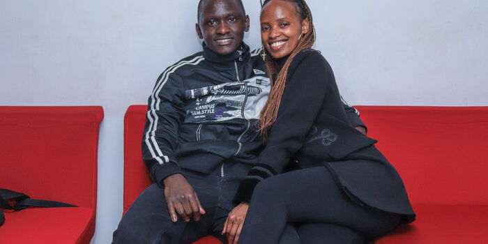 A romantic couple poses for the camera.