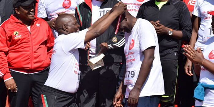 Image result for DP Ruto wins âgoldâ in half-marathon