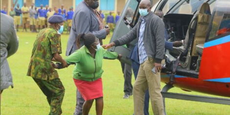 CS Matiang'i Looks On as Police Officers Pull Away Woman Who Breached his Security.